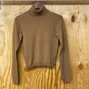 Winter warmth and style.  Moda International Brown Turtleneck Sweater